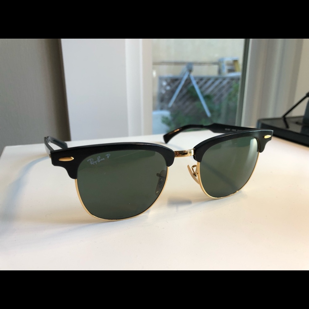 Black and gold Ray-Ban sunglasses, unisex.